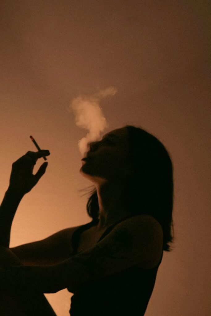 a woman smoking a cigarette